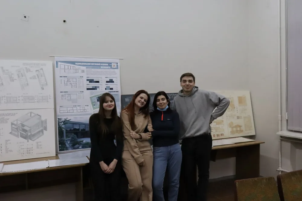 Students with architectural presentation boards