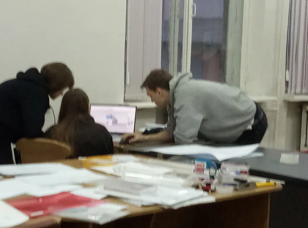 Students working at a drawing table