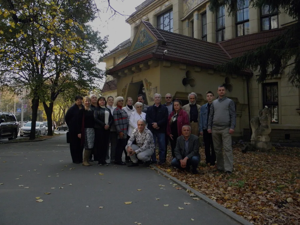 Students and teachers outside an academic building