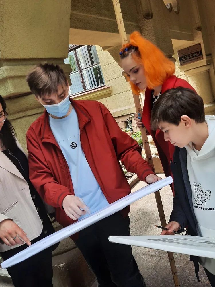 Students reviewing a drawing together