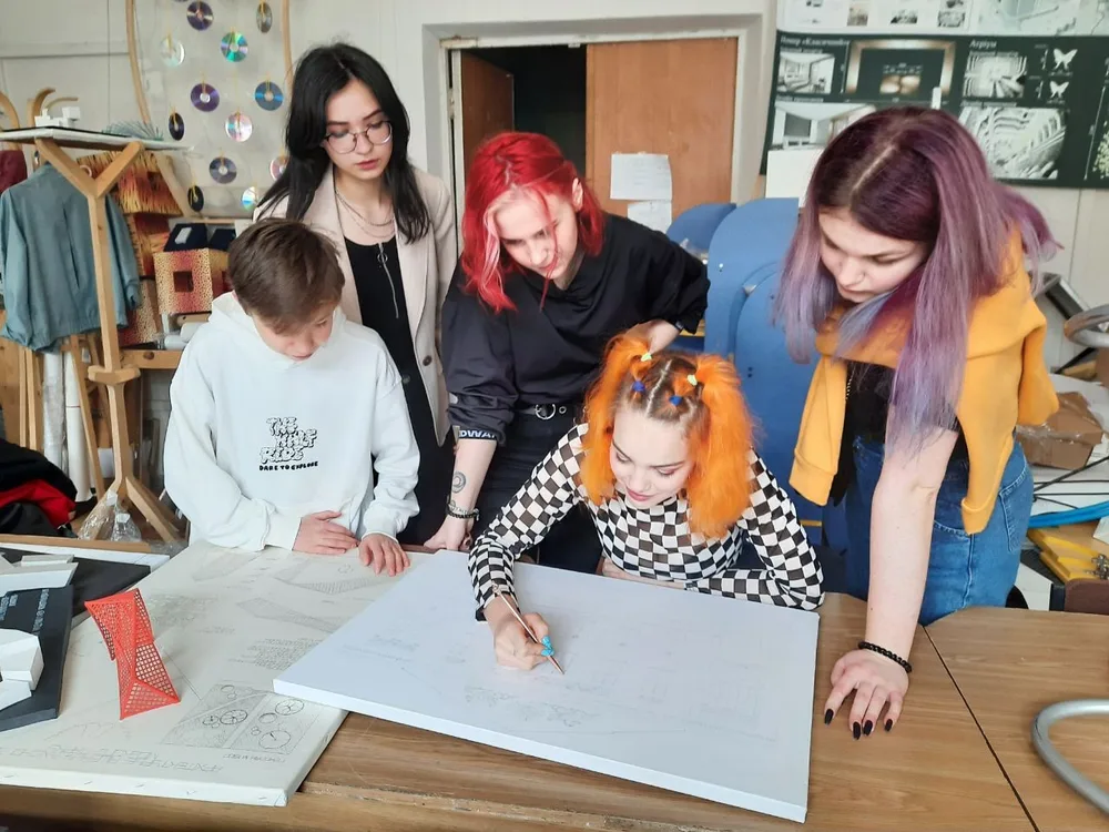 A group reviewing architectural drawings at a table
