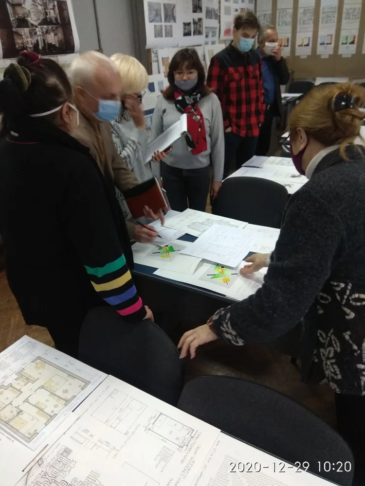 Students discussing a design in a classroom